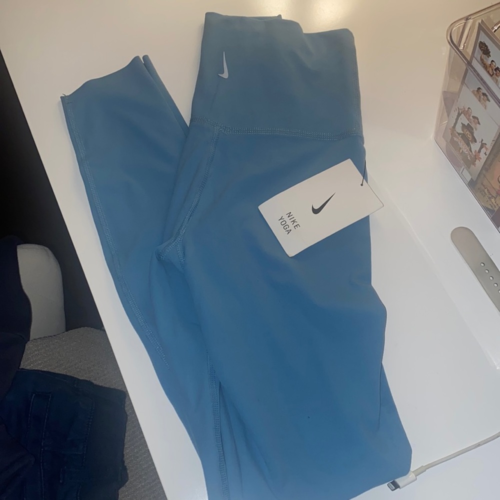 Women light blue Nike yoga high rise 7/8 length XXS